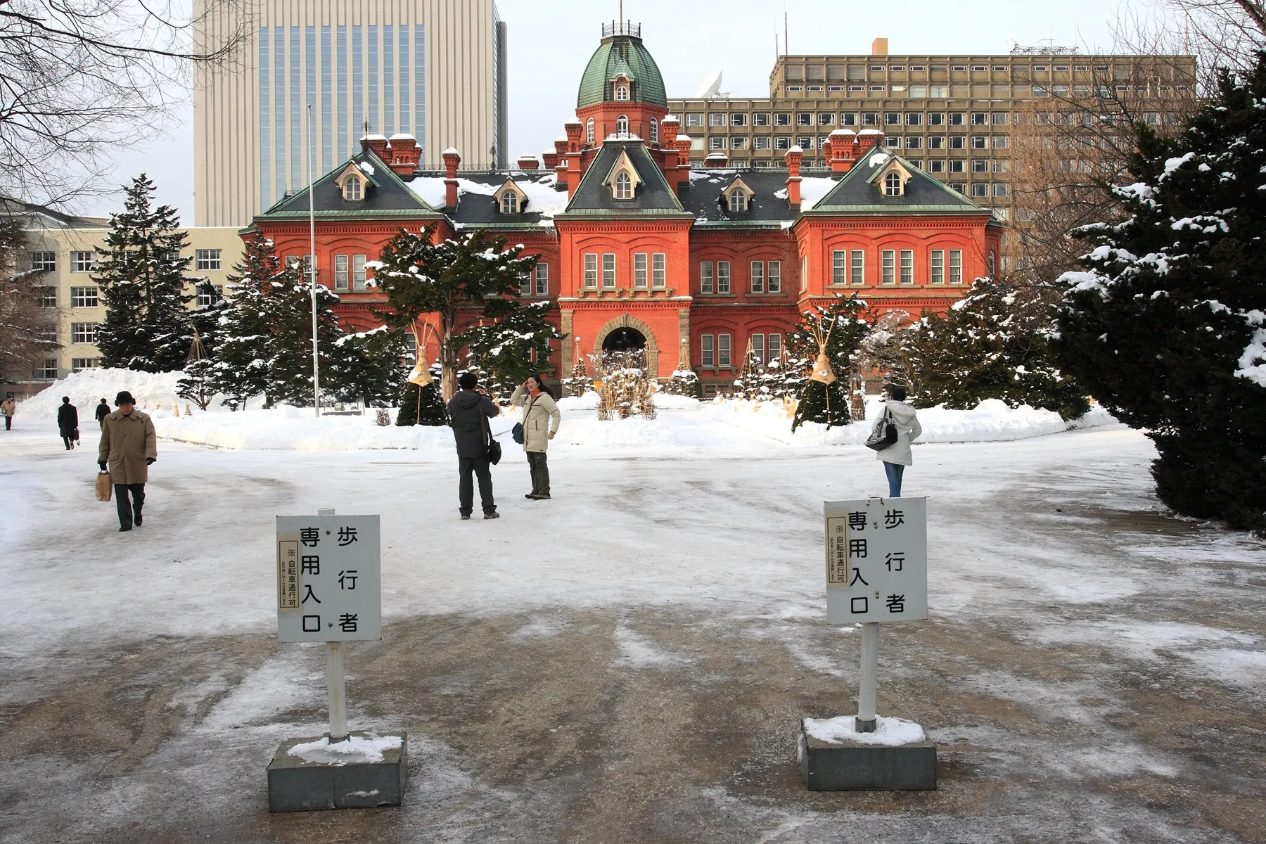 The red-brick Former Hokkaido Government Office Building in Sapporo, with snow covering the grounds in front