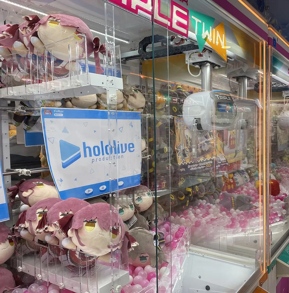 Claw machines filled with plush toys in a GiGO game center in Akihabara