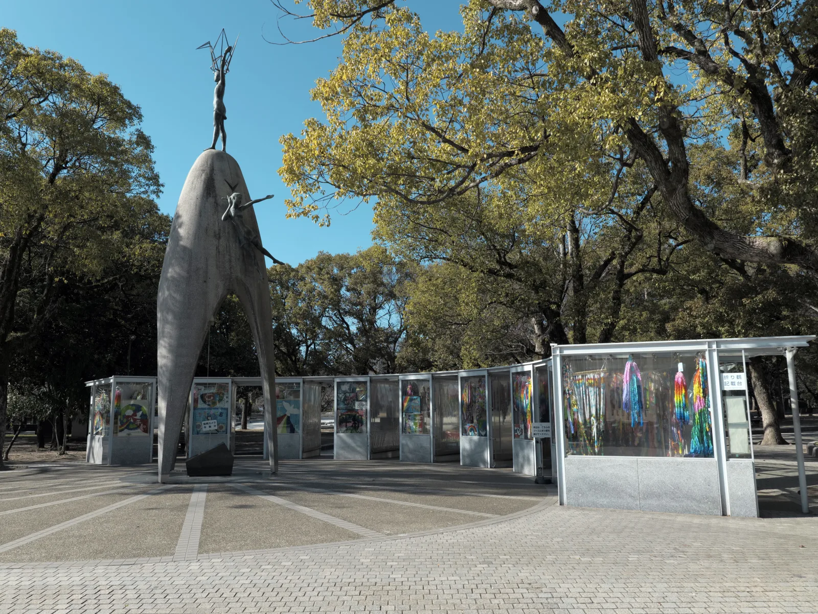 The Children's Peace Monument with glass cases of paper cranes around it