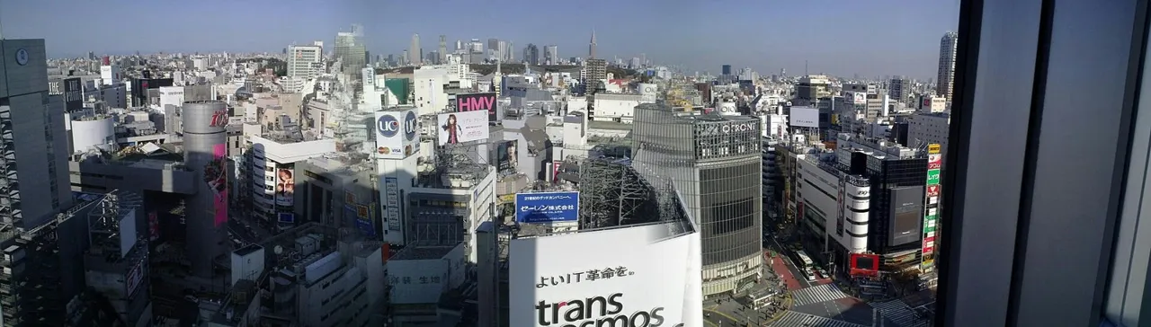 View from the 16th floor of Shibuya Excel Hotel Tokyu: the dense buildings and signs of Shibuya seen through a window